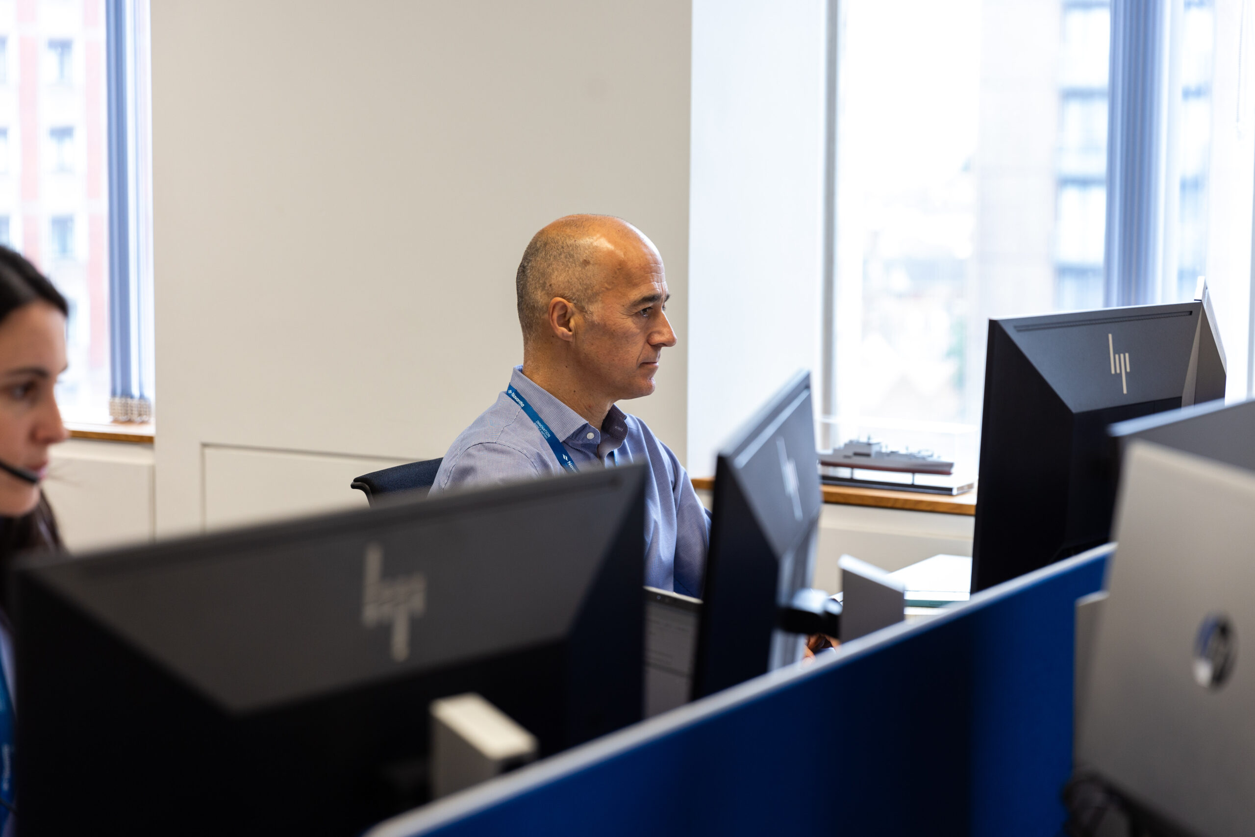 Employee working diligently on a computer, focused on tasks